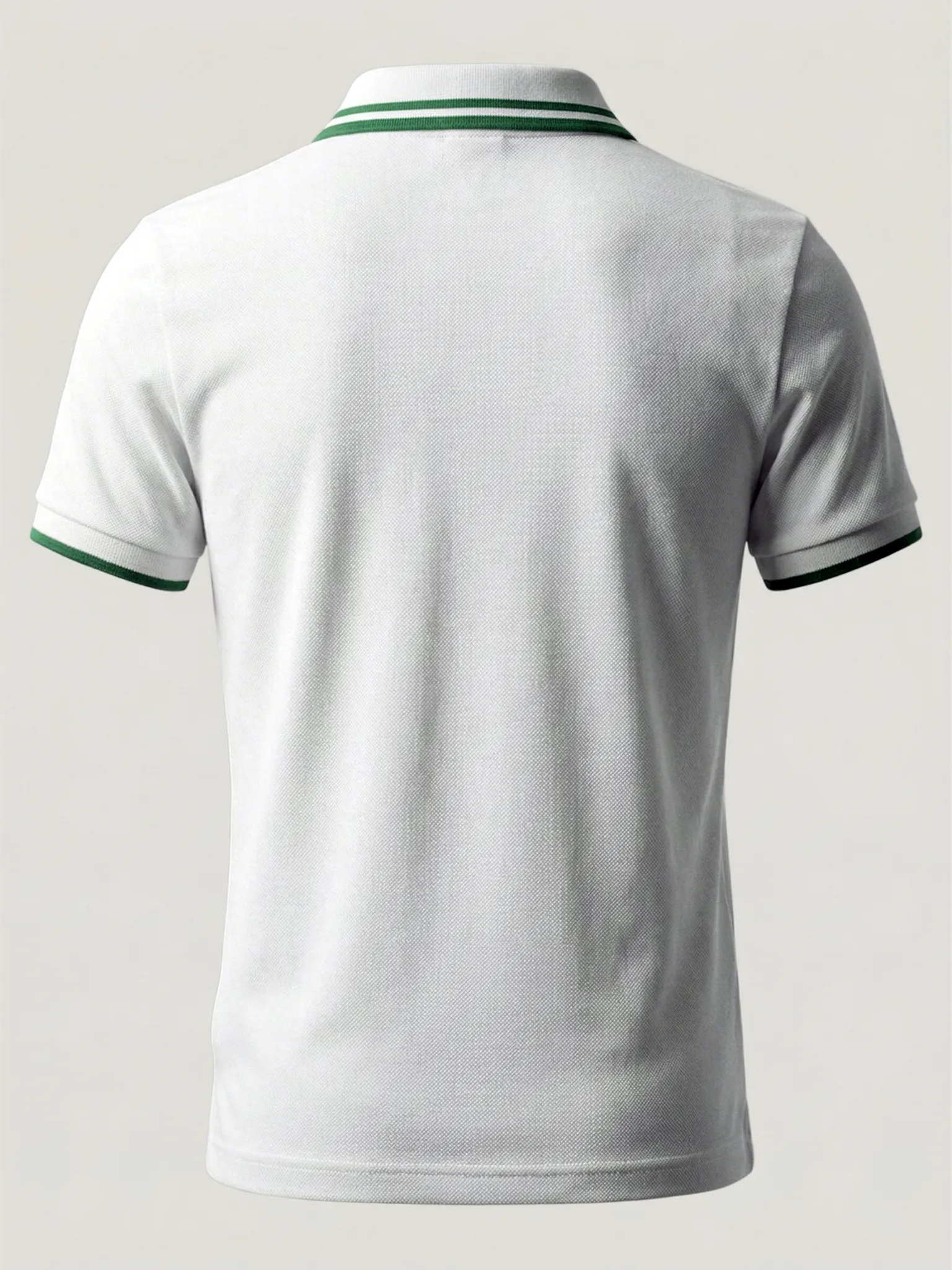 White polo shirt with green accents on a light gray background