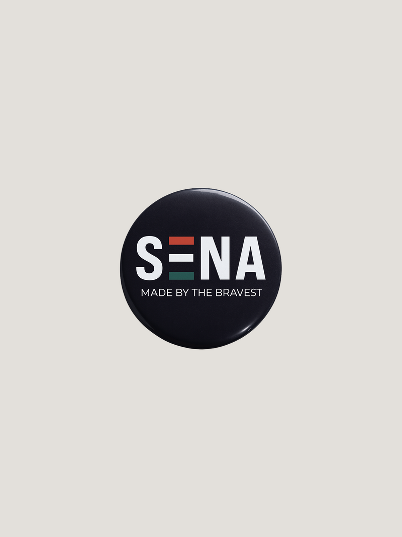 Round black button with 'SENA' logo and text on a light gray background